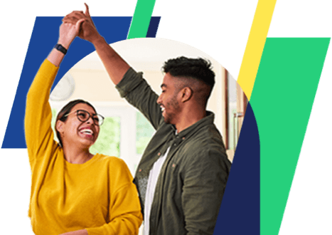 a woman in a yellow sweater and glasses smiles and dances with a man in a green jacket